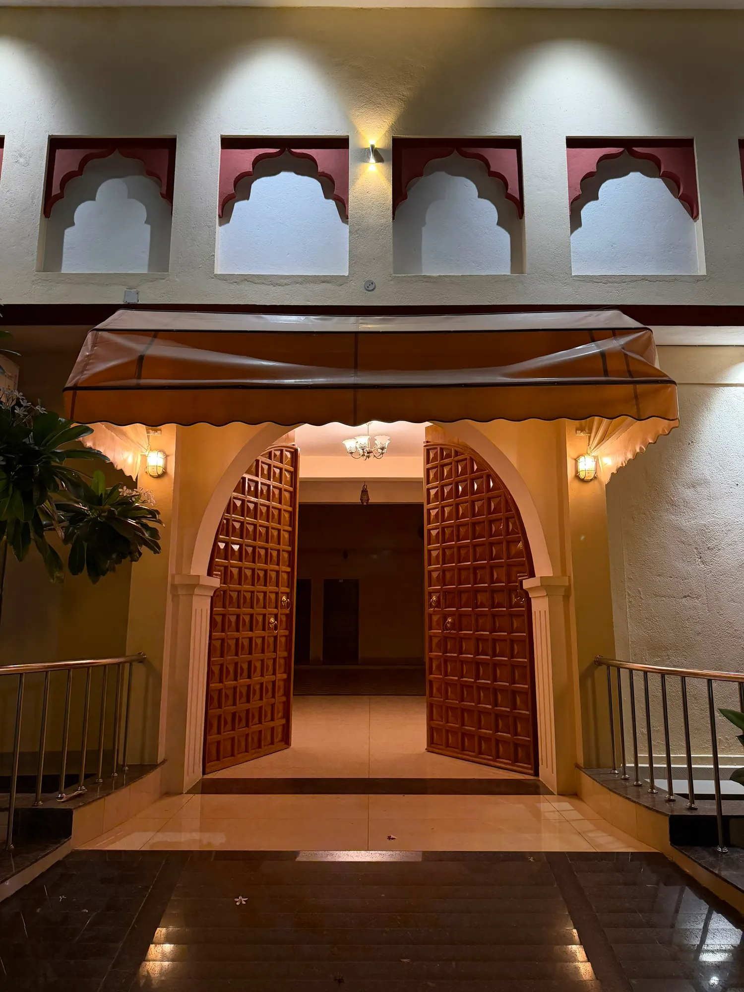 The carved main doors, open